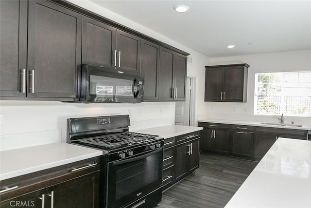 27488 Ginger Ct, Saugus, CA 91350 - kitchen with a sink, black appliances, recessed lighting, dark brown cabinetry, and light countertops