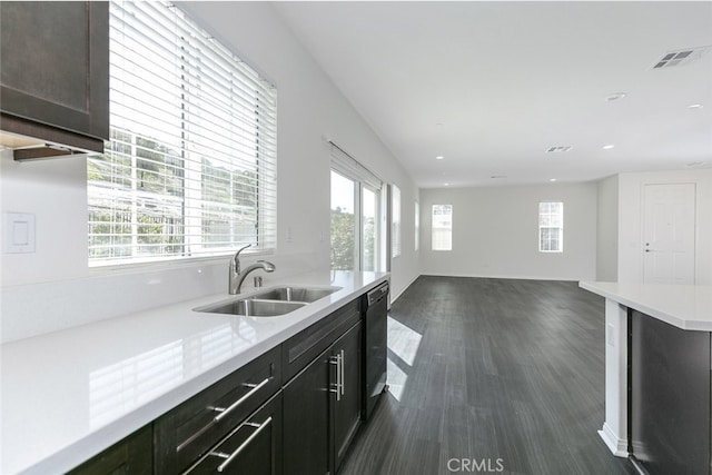 27488 Ginger Ct, Saugus, CA 91350 - kitchen with black dishwasher, plenty of natural light, light countertops, and a sink