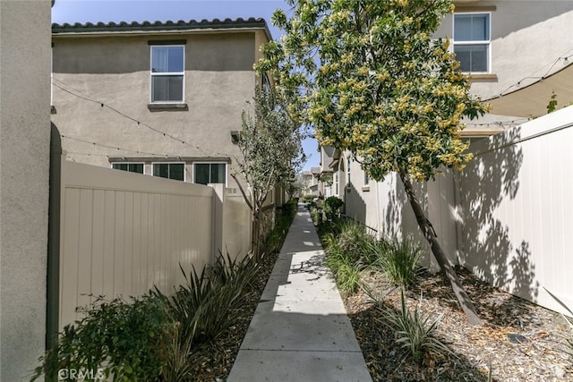 27488 Ginger Ct, Saugus, CA 91350 - view of property exterior featuring stucco siding and fence