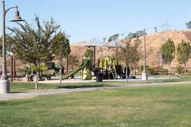 27488 Ginger Ct, Saugus, CA 91350 - view of property's community with playground community and a lawn