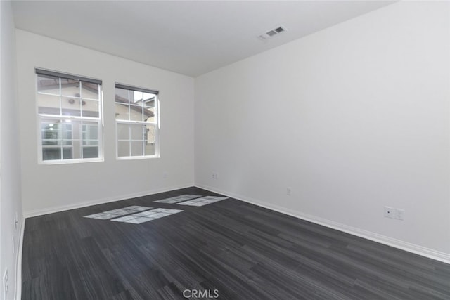 27488 Ginger Ct, Saugus, CA 91350 - spare room with baseboards, visible vents, and dark wood-type flooring