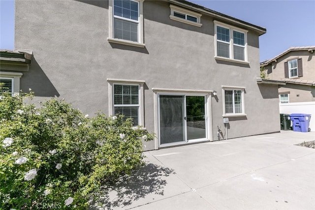 27488 Ginger Ct, Saugus, CA 91350 - rear view of property featuring stucco siding and a patio