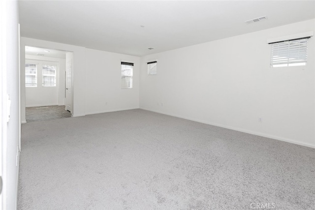 27488 Ginger Ct, Saugus, CA 91350 - carpeted spare room with baseboards, a wealth of natural light, and visible vents