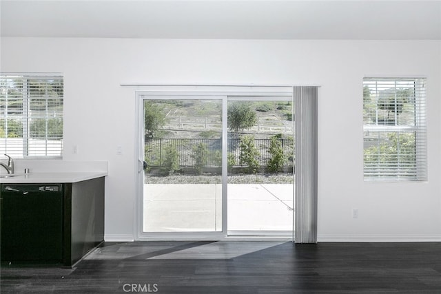27488 Ginger Ct, Saugus, CA 91350 - doorway to outside with dark wood-style flooring, baseboards, and a sink