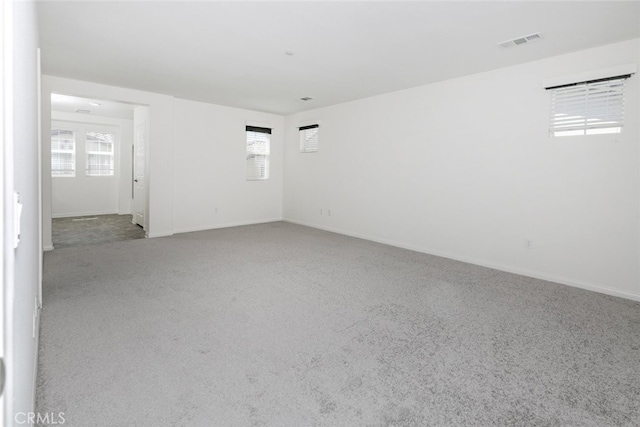 27488 Ginger Ct, Saugus, CA 91350 - spare room with baseboards, plenty of natural light, visible vents, and carpet