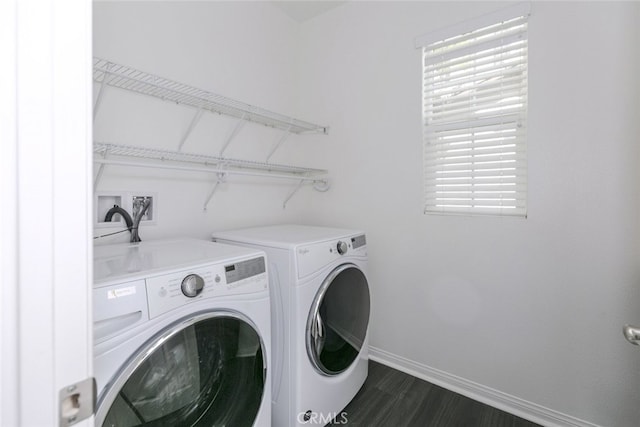 27488 Ginger Ct, Saugus, CA 91350 - washroom featuring washing machine and clothes dryer, baseboards, dark wood finished floors, and laundry area