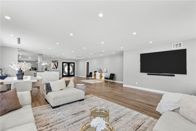 17321 Lahey St, Granada Hills, CA 91344 - living area with visible vents, recessed lighting, baseboards, and wood finished floors