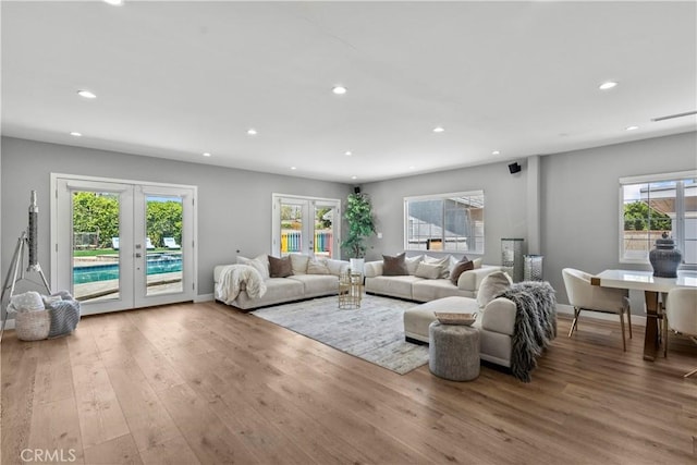 17321 Lahey St, Granada Hills, CA 91344 - living area featuring plenty of natural light, french doors, recessed lighting, and wood finished floors