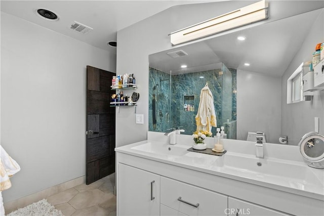 17321 Lahey St, Granada Hills, CA 91344 - bathroom featuring double vanity, visible vents, a marble finish shower, and a sink