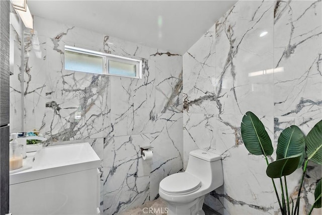 17321 Lahey St, Granada Hills, CA 91344 - bathroom featuring toilet, tile walls, and vanity
