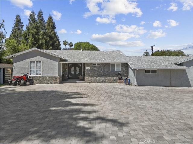 17321 Lahey St, Granada Hills, CA 91344 - ranch-style house featuring stone siding and stucco siding