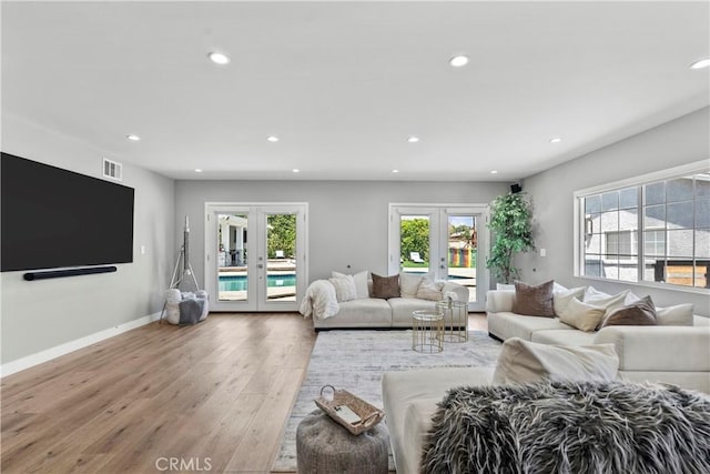 17321 Lahey St, Granada Hills, CA 91344 - living area with french doors, visible vents, wood finished floors, baseboards, and recessed lighting