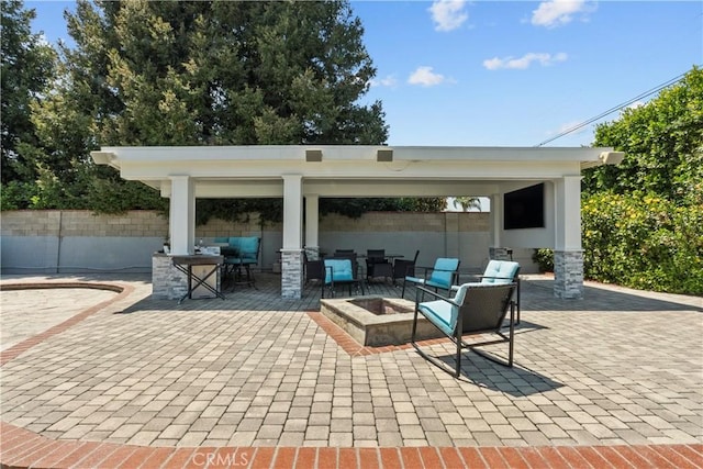 17321 Lahey St, Granada Hills, CA 91344 - view of patio featuring fence and an outdoor living space with a fire pit