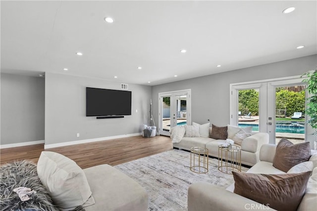 17321 Lahey St, Granada Hills, CA 91344 - living area featuring french doors, recessed lighting, baseboards, and wood finished floors