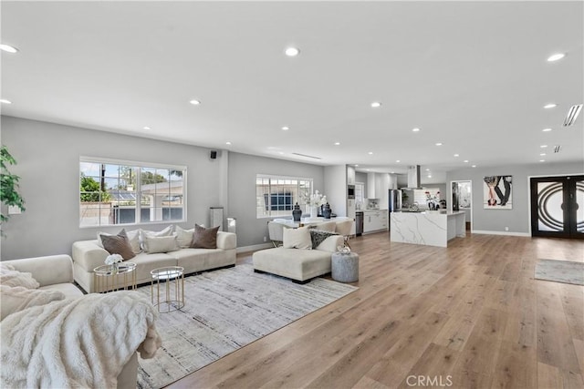 17321 Lahey St, Granada Hills, CA 91344 - living room with recessed lighting, baseboards, and light wood finished floors