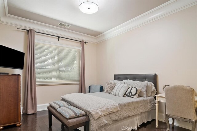 bedroom featuring crown molding, baseboards, visible vents, and dark wood-type flooring