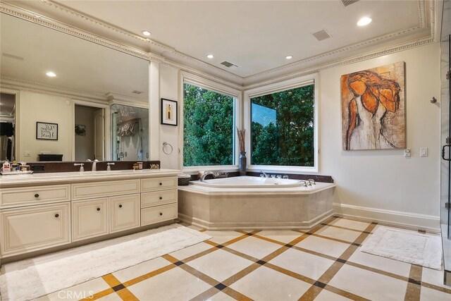 bathroom featuring vanity, crown molding, a garden tub, recessed lighting, and a stall shower