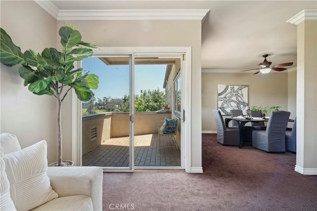 entryway featuring crown molding, a ceiling fan, carpet flooring, and baseboards