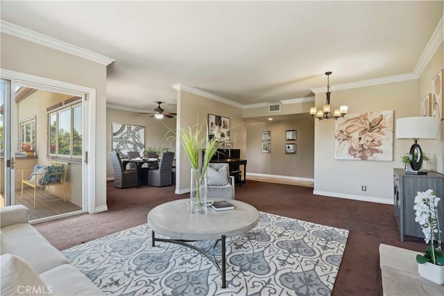 living room with ceiling fan with notable chandelier, ornamental molding, carpet flooring, and visible vents