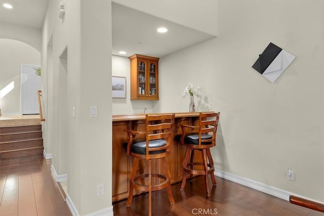 519 S Lucia Ave, Redondo Beach, CA 90277 - bar with dark wood-style flooring, indoor wet bar, baseboards, stairway, and recessed lighting