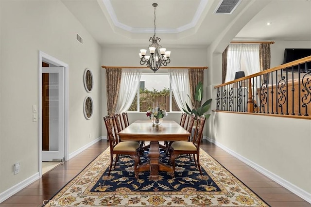 519 S Lucia Ave, Redondo Beach, CA 90277 - dining room featuring hardwood / wood-style flooring, a chandelier, a tray ceiling, and visible vents