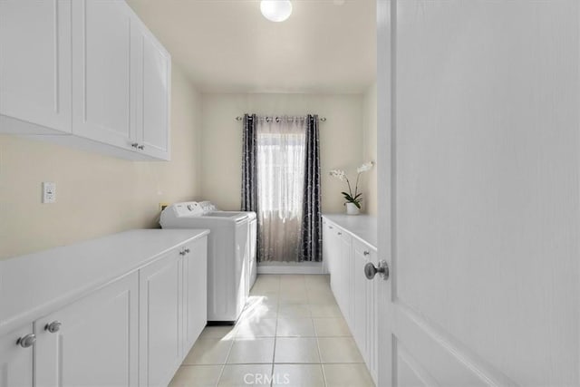 519 S Lucia Ave, Redondo Beach, CA 90277 - clothes washing area with light tile patterned floors, cabinet space, and washer and clothes dryer