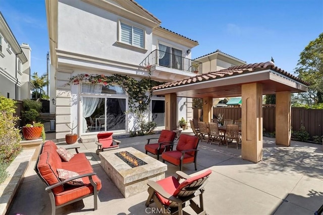 519 S Lucia Ave, Redondo Beach, CA 90277 - back of property with a gazebo, an outdoor fire pit, a tile roof, stucco siding, and a patio