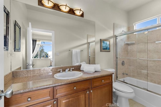519 S Lucia Ave, Redondo Beach, CA 90277 - bathroom with toilet, a wealth of natural light, bath / shower combo with glass door, and vanity