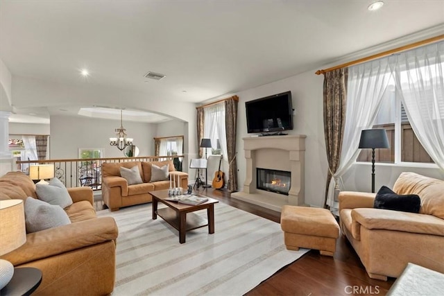 519 S Lucia Ave, Redondo Beach, CA 90277 - living area with visible vents, plenty of natural light, wood finished floors, and an inviting chandelier