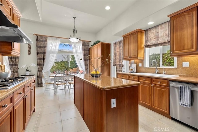 519 S Lucia Ave, Redondo Beach, CA 90277 - kitchen with decorative backsplash, a center island, under cabinet range hood, a sink, and appliances with stainless steel finishes