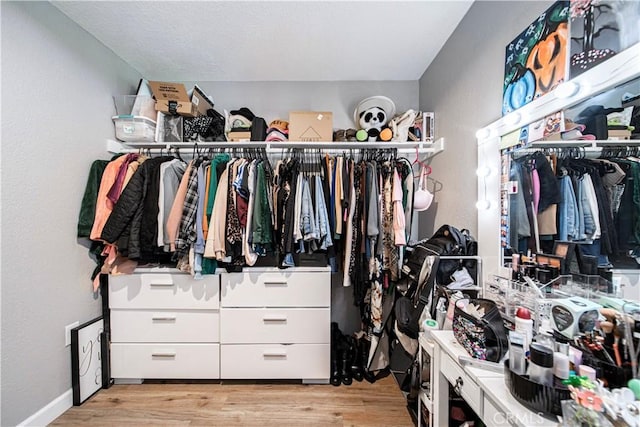 spacious closet with light wood finished floors