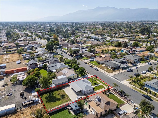 aerial perspective of suburban area with mountains and property parcel outlined