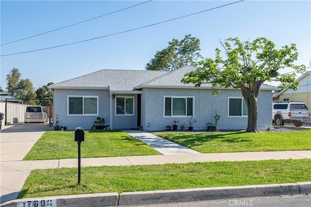 view of front of home featuring stucco siding, roof with shingles, and concrete driveway