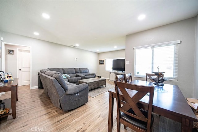 living room with light wood-style floors and recessed lighting