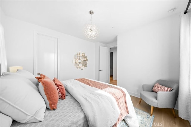 bedroom featuring wood finished floors