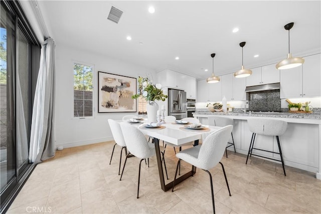 dining space with recessed lighting, baseboards, visible vents, and light tile patterned floors