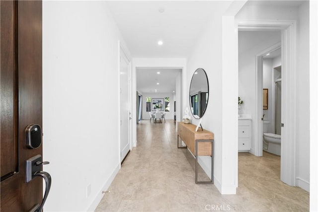 hall with recessed lighting