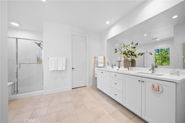 full bath with recessed lighting, a sink, and a stall shower