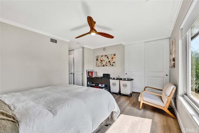 6702 Sun Dr Unit C, Huntington Beach, CA 92647 - bedroom featuring a ceiling fan, visible vents, ornamental molding, and wood finished floors