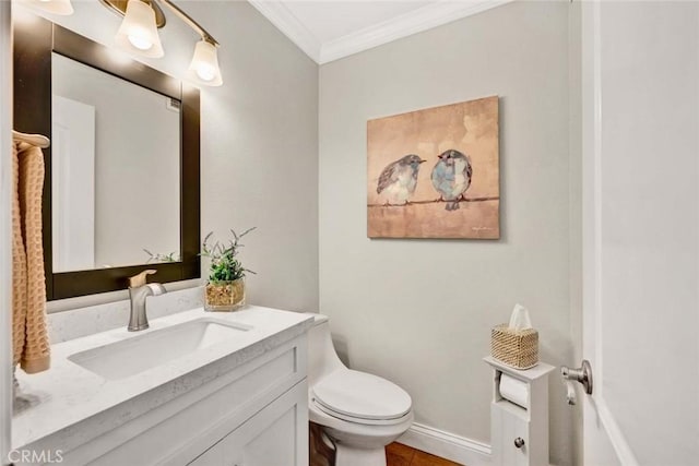 6702 Sun Dr Unit C, Huntington Beach, CA 92647 - bathroom featuring vanity, ornamental molding, baseboards, and toilet