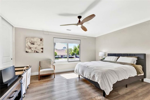 6702 Sun Dr Unit C, Huntington Beach, CA 92647 - bedroom with light wood-style floors, baseboards, a ceiling fan, and visible vents
