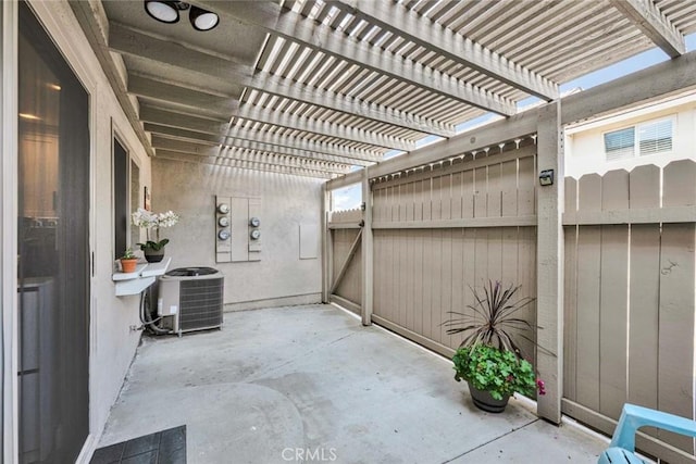 6702 Sun Dr Unit C, Huntington Beach, CA 92647 - view of patio / terrace with fence, a pergola, and central AC