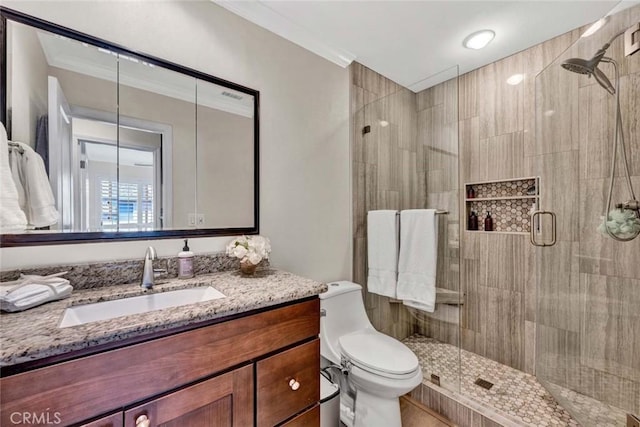 6702 Sun Dr Unit C, Huntington Beach, CA 92647 - bathroom featuring vanity, ornamental molding, a stall shower, and toilet