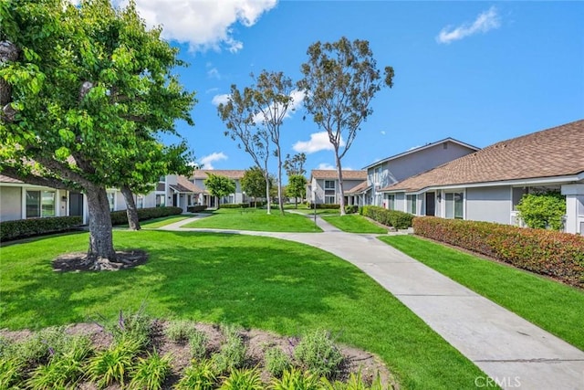 6702 Sun Dr Unit C, Huntington Beach, CA 92647 - surrounding community featuring a lawn and a residential view