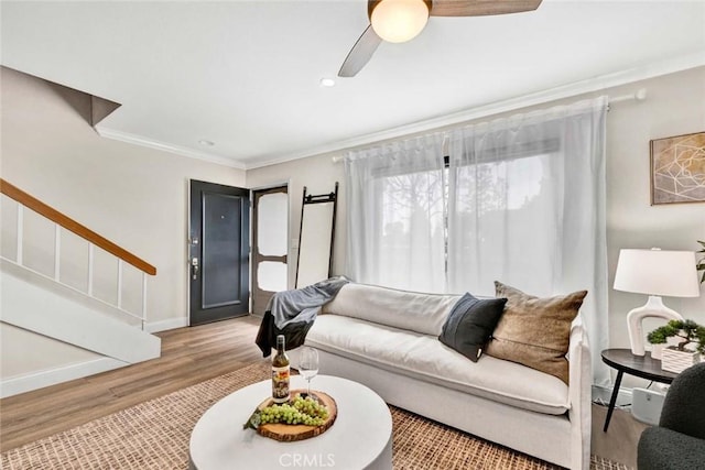 6702 Sun Dr Unit C, Huntington Beach, CA 92647 - living room with ceiling fan, stairs, wood finished floors, ornamental molding, and recessed lighting