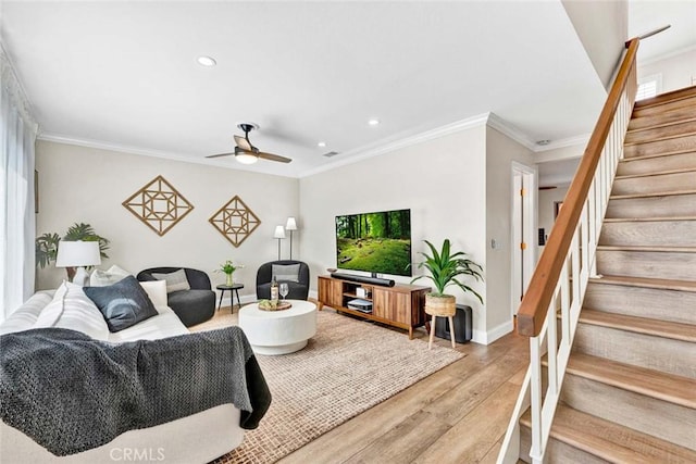 6702 Sun Dr Unit C, Huntington Beach, CA 92647 - living room featuring ceiling fan, light wood-style flooring, stairs, recessed lighting, and ornamental molding