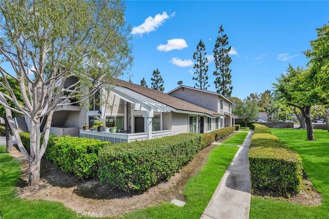 6702 Sun Dr Unit C, Huntington Beach, CA 92647 - view of side of property featuring stucco siding