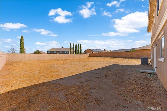 42570 72nd St W, Lancaster, CA 93536 - view of yard with cooling unit and a fenced backyard