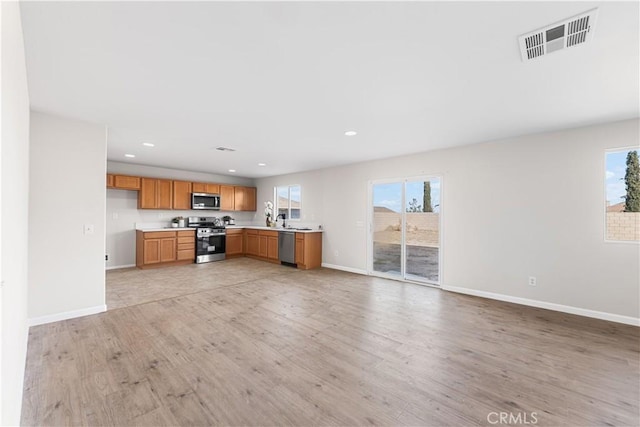 42570 72nd St W, Lancaster, CA 93536 - unfurnished living room with visible vents, recessed lighting, light wood finished floors, and baseboards