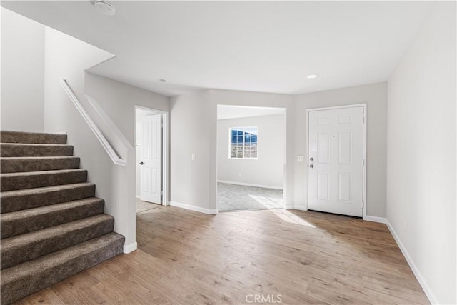 42570 72nd St W, Lancaster, CA 93536 - foyer with baseboards, light wood-style flooring, and stairs